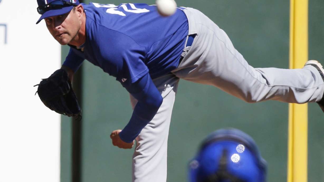FILE - Italy's Dan Serafini throws before the first inning of an exhibition spring training baseball game against the Los Angeles Angels Wednesday, March 6, 2013, in Tempe, Ariz.