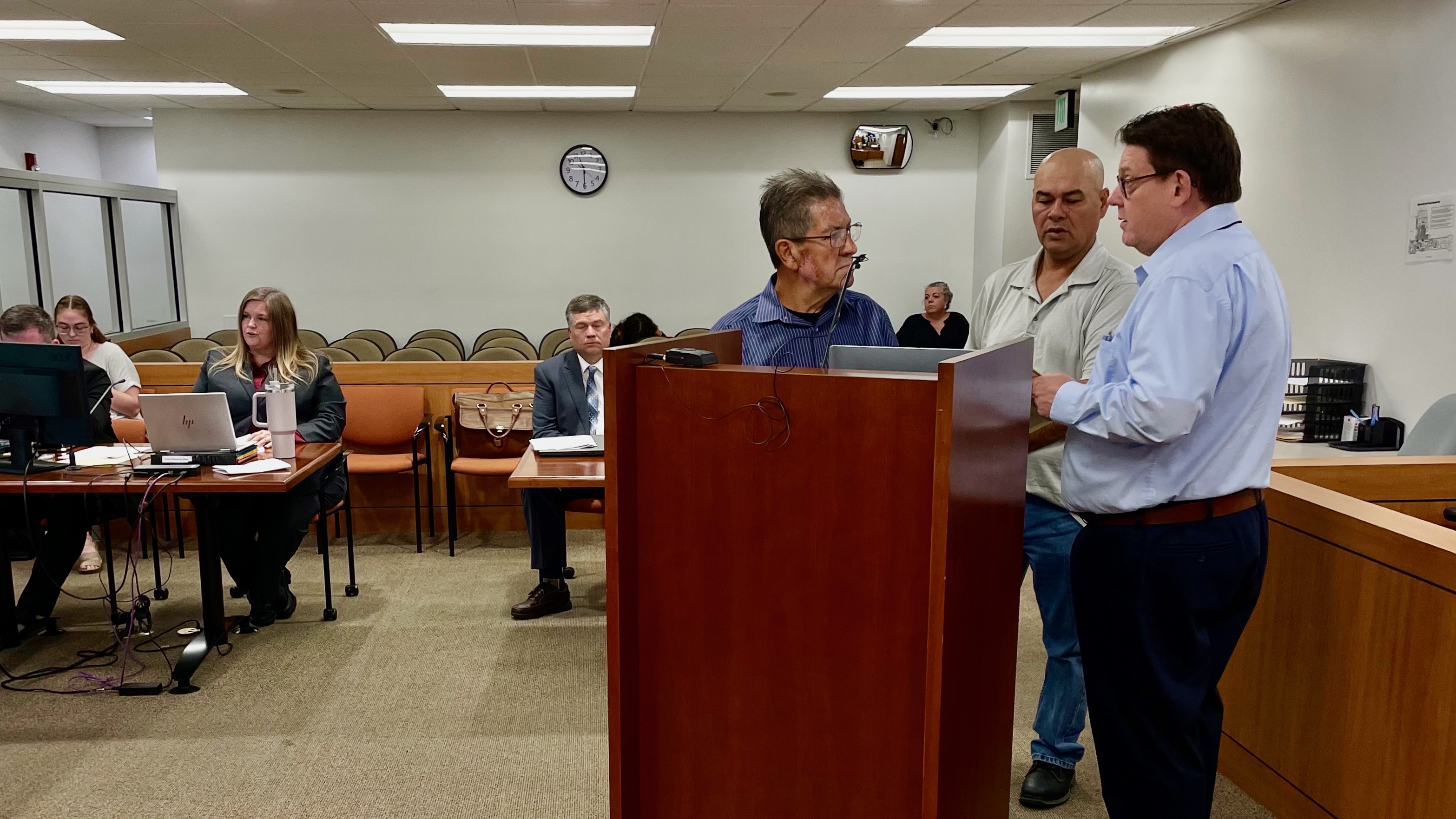 Miguel Salgado Vargas, center, and his nephew Ramon Aispuro Cano, center right, at their first court appearance in a dog-hoarding case at Ogden Justice Court on Tuesday.