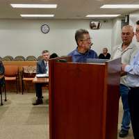 Not guilty pleas entered for 2 men in Ogden dog-hoarding case