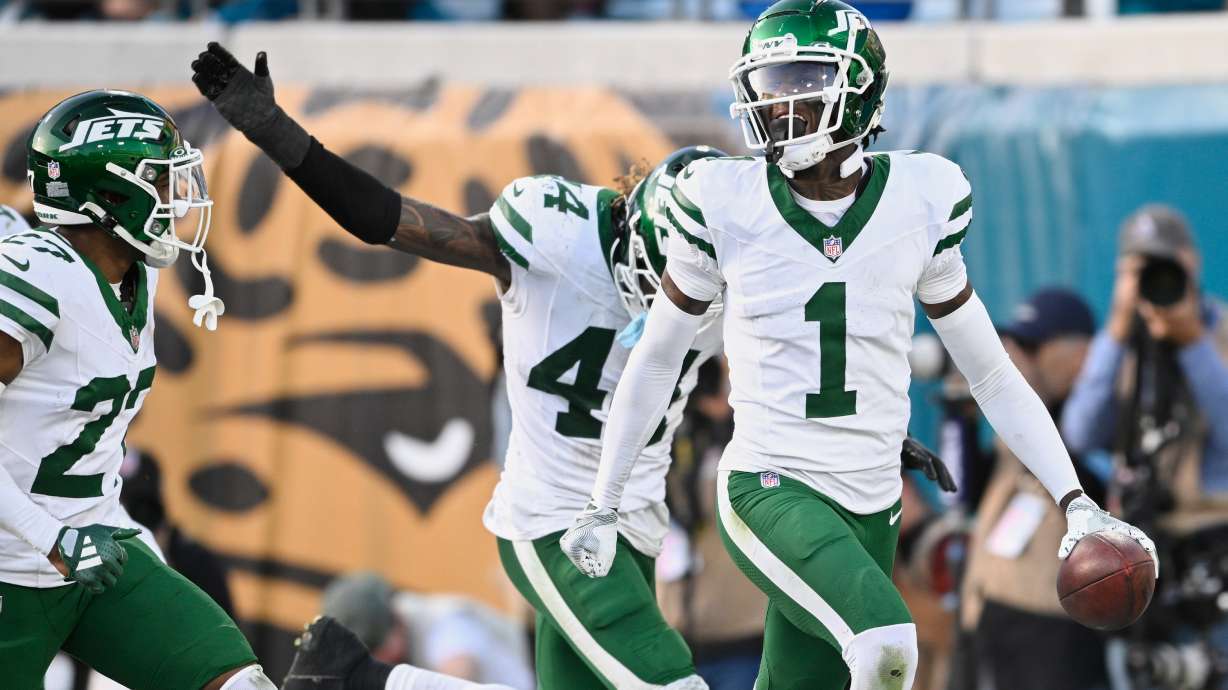 FILE - New York Jets cornerback Sauce Gardner (1) celebrates after intercepting a pass against the Jacksonville Jaguars during the second half of an NFL football game Sunday, Dec. 15, 2024, in Jacksonville, Fla.