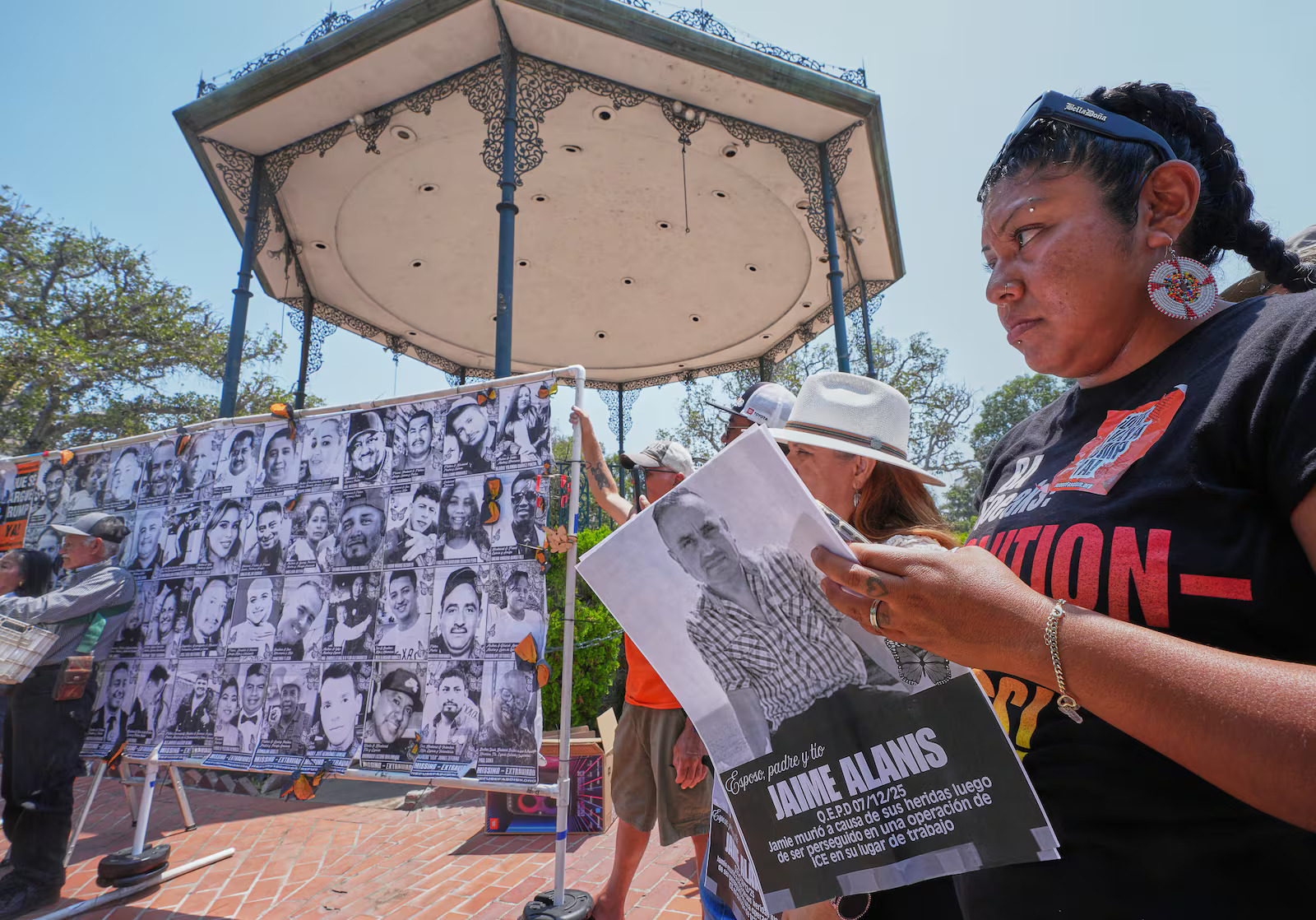Activist and farm worker Xochitl Nunez holds up a picture of farm worker Jaime Alanis at a news conference in Los Angeles, Monday. Legislation was introduced in Congress Tuesday that would provide protections for some undocumented immigrants.