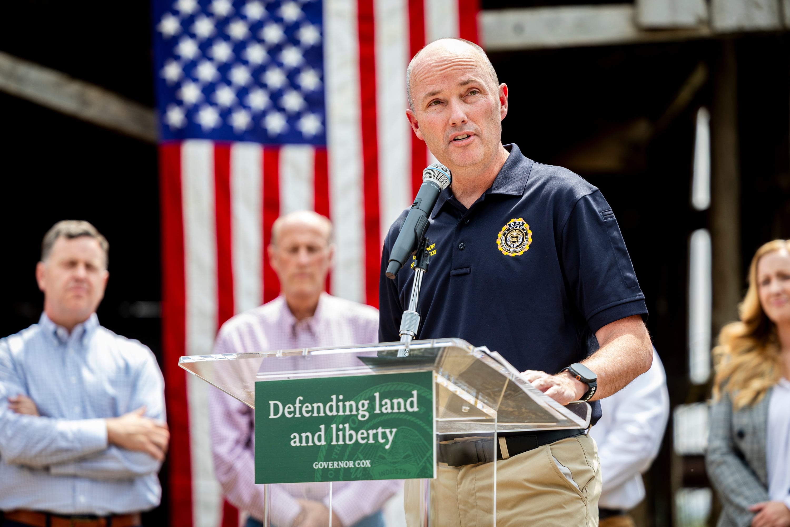 Gov. Spencer Cox speaks during a press conference at a farm in Palmyra on Tuesday, about efforts to safeguard Utah’s land, liberty and strategic interests from foreign influence.
