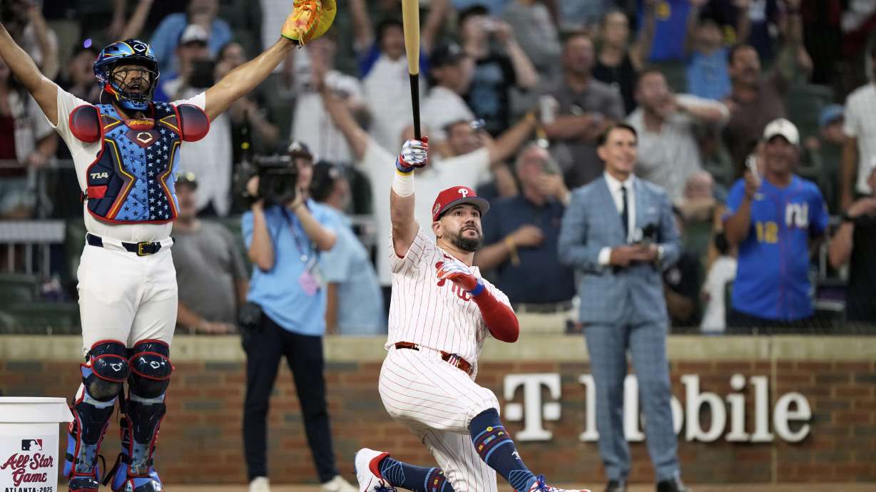 Philadelphia Phillies Kyle Schwarber celebrates after winning the tiebreaker at the MLB baseball All-Star game between the American League and National League, Tuesday, July 15, 2025, in Atlanta.
