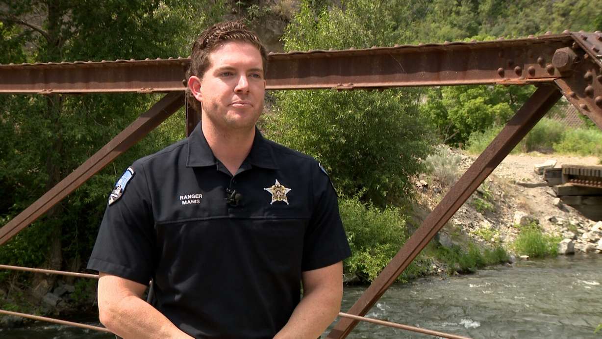 Ranger Wyatt Manis is pictured on Tuesday, July 15, 2025 at the Provo River. He described jumping into the cold water to save a trapped paddleboarder several weeks ago.