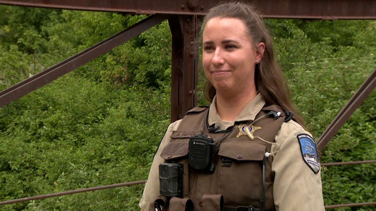 Conservation Officer Aidan Hueton is pictured Tuesday at the Provo River. She described helping in the rescue of a paddleboarder who was trapped in the water several weeks ago.