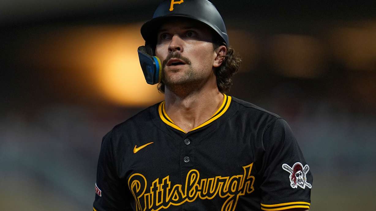 Pittsburgh Pirates' Adam Frazier walks back to the dugout after striking out during the ninth inning of a baseball game against the Minnesota Twins, Friday, July 11, 2025, in Minneapolis.