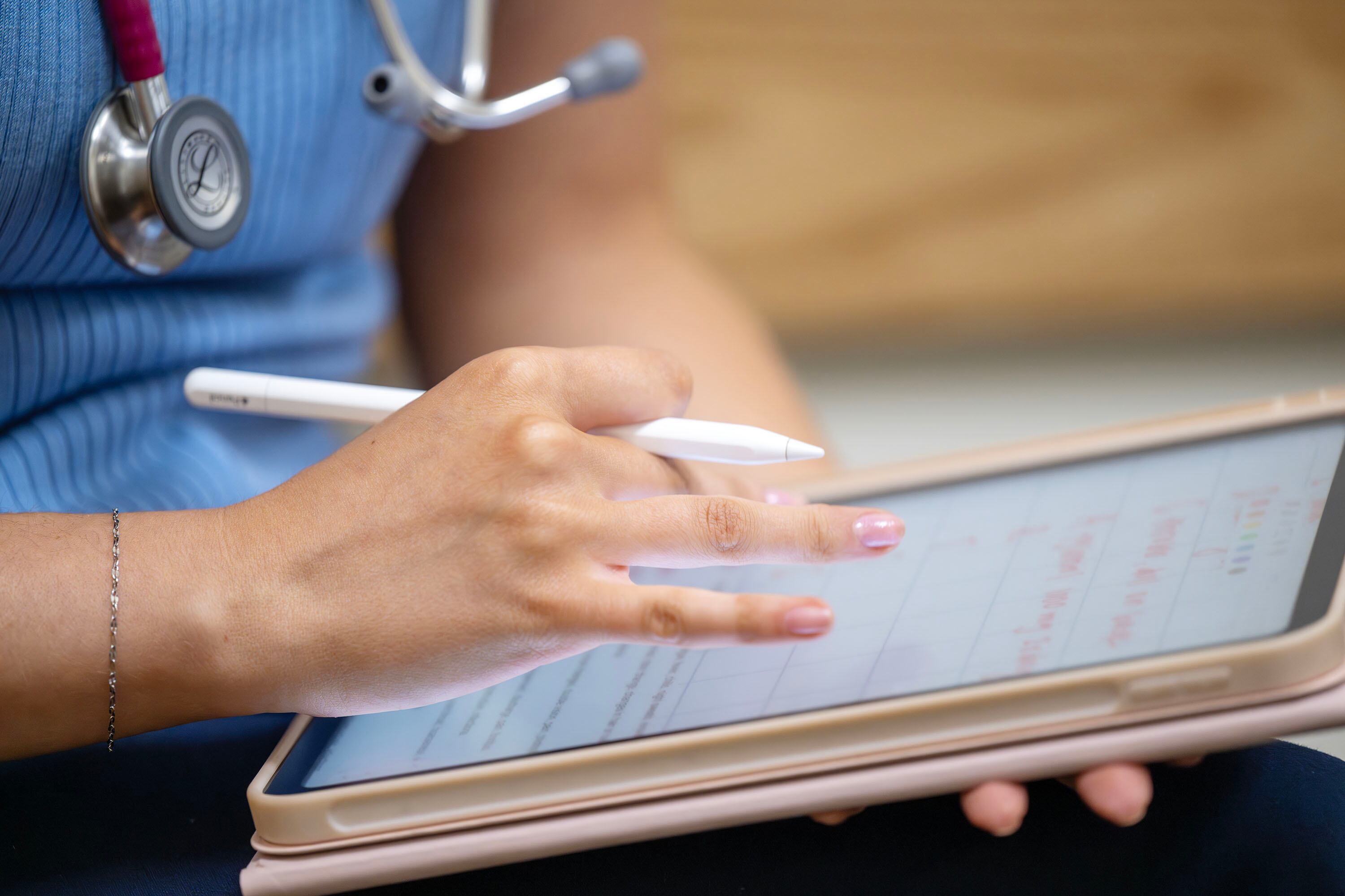 Giuliana Miller takes notes on a computer pad in a mock exam room in Orem on Tuesday. President Astrid Tuminez said the future Bingham Family Clinic will prepare students "to lead with skill, empathy, and purpose."