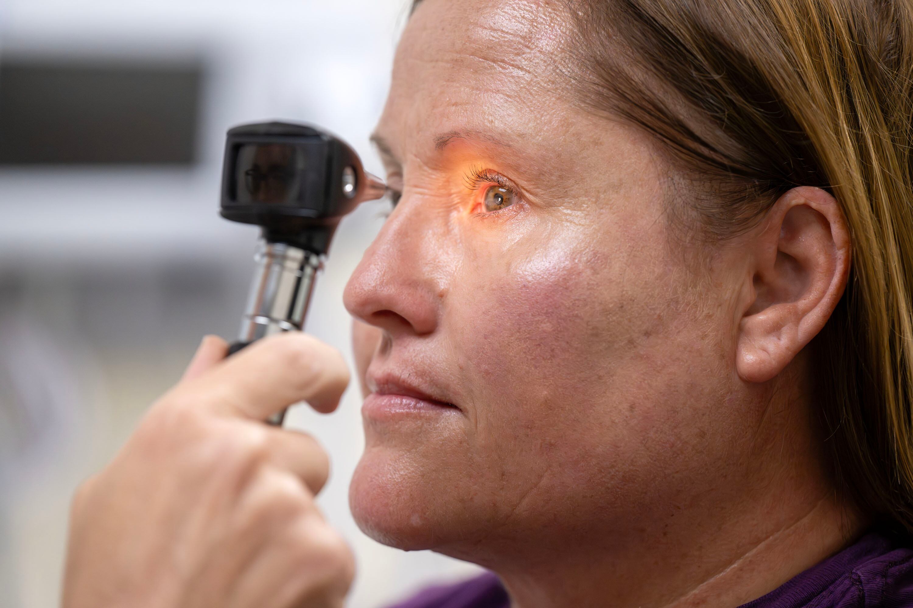 Simulated patient Amber Montgomery has her eyes checked by PA student Liz Tillman while in a mock exam room in Orem on Tuesday. UVU said the future Bingham Family Clinic will be "a place of healing and education."