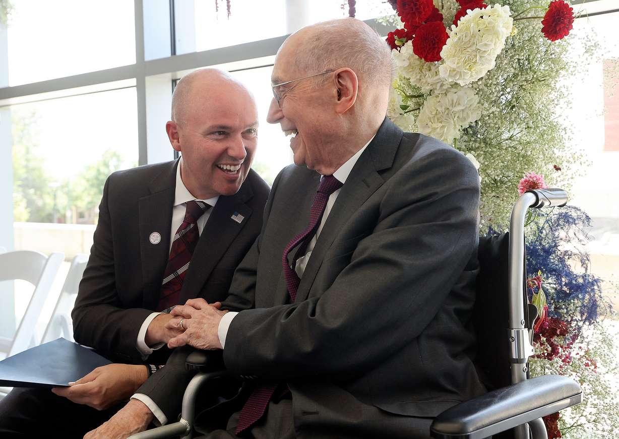 Gov. Spencer Cox and President Henry B. Eyring, second counselor in the First Presidency of The Church of Jesus Christ of Latter-day Saints, talk during a ribbon-cutting event for the L.S. Skaggs Applied Science Building at the University of Utah in Salt Lake City on Wednesday.