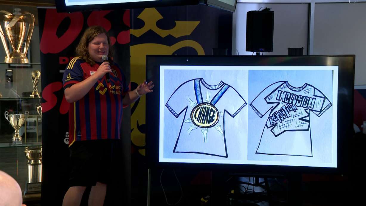 A Special Olympics athlete shares his T-shirt design at America First Field on Wednesday. The event marked the first time athletes designed merchandise, with the help of guest designers and graphic designers.