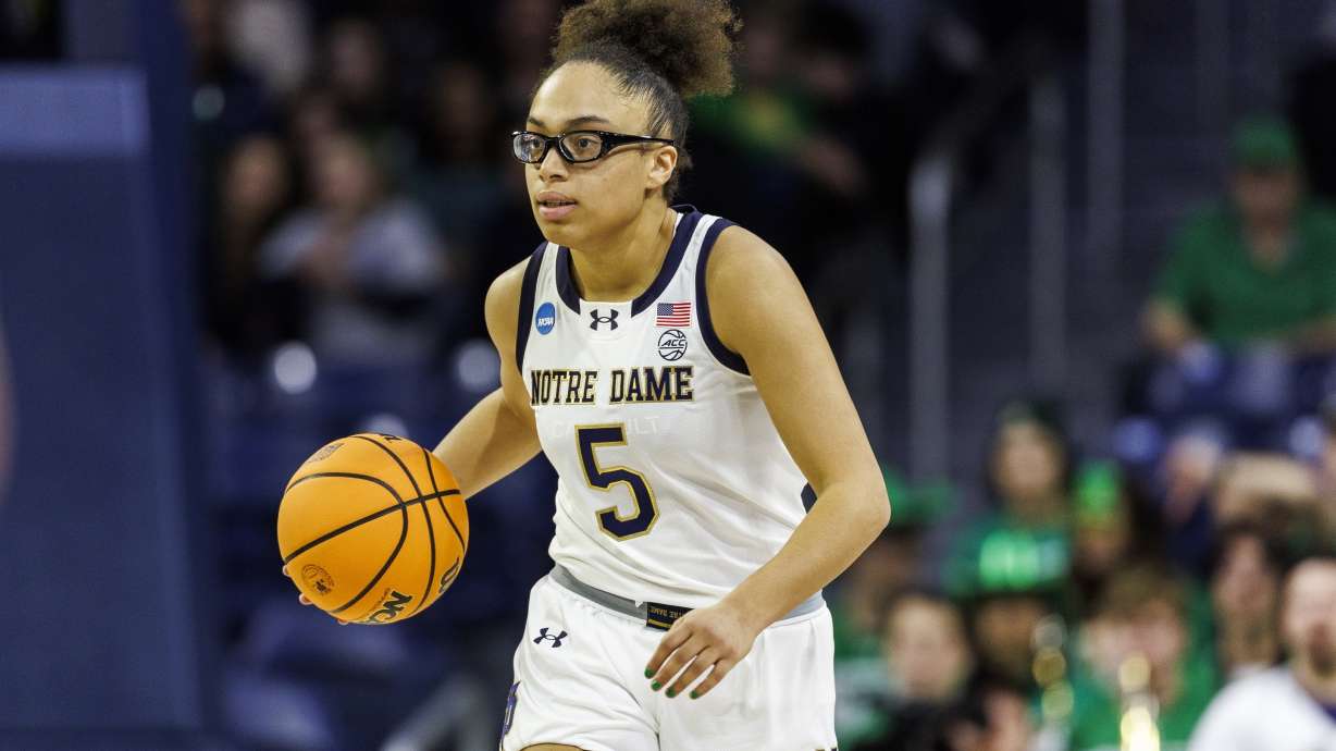 FILE - Notre Dame guard Olivia Miles (5) advances the ball during the second half in the first round of the NCAA college basketball tournament against Stephen F. Austin, March 21, 2025, in South Bend, Ind.