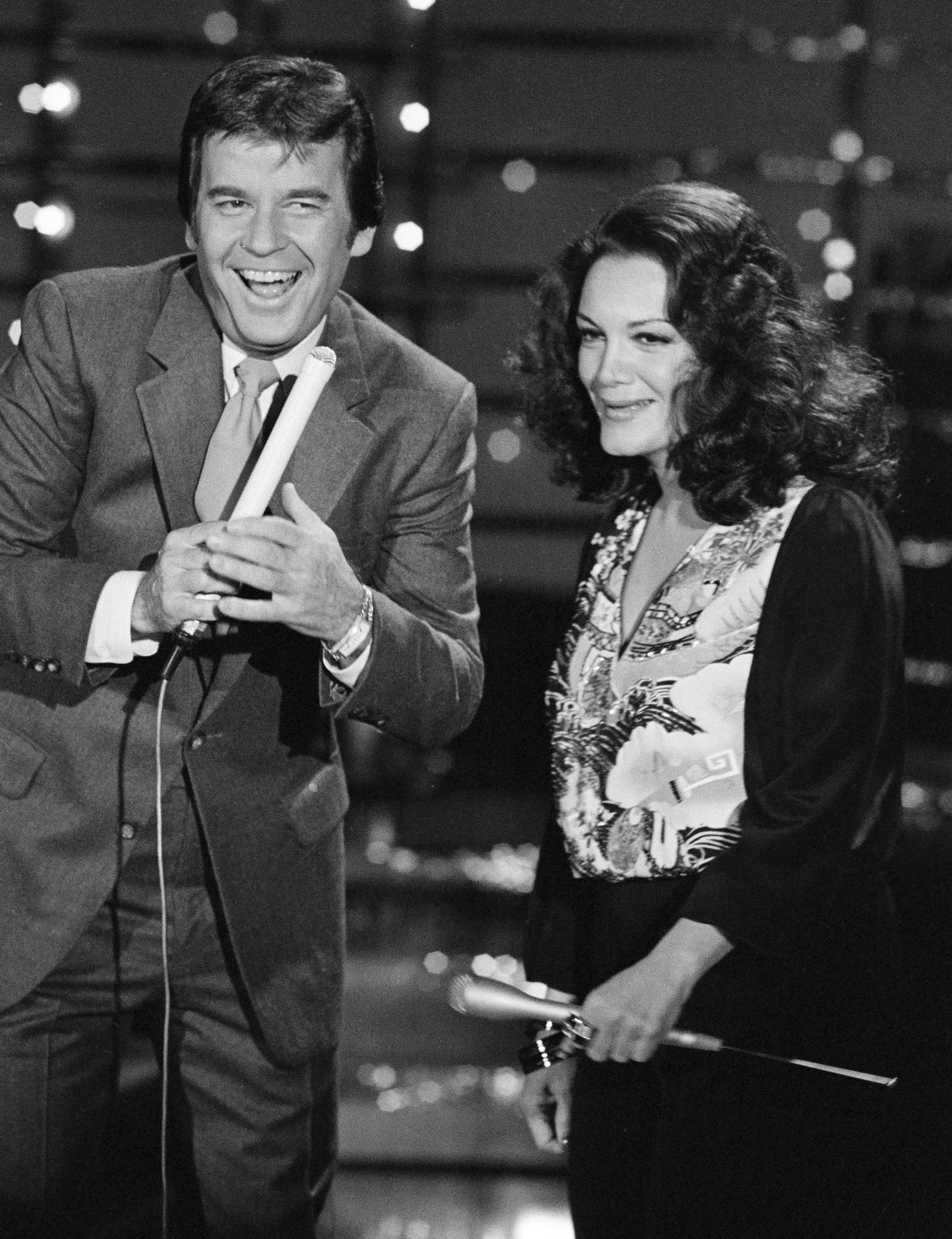 In this Dec. 9, 1980 photo, Dick Clark, host of American Bandstand, left, appears with Connie Francis during taping of the show in Los Angeles.