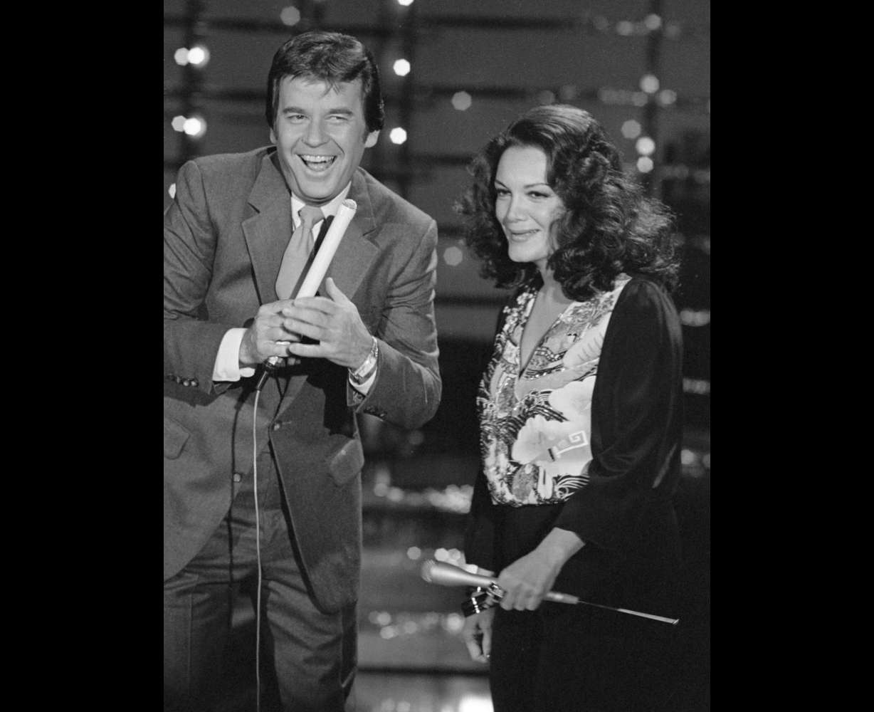 In this Dec. 9, 1980 photo, Dick Clark, host of American Bandstand, left, appears with Connie Francis during taping of the show in Los Angeles.
