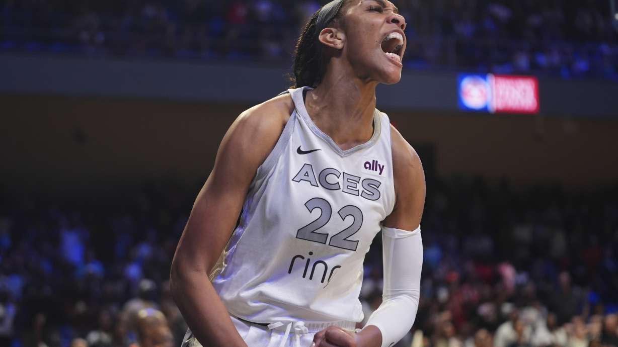 Las Vegas Aces center A'ja Wilson (22) reacts to scoring during the second half of a WNBA basketball game against the Dallas Wings in Arlington, Texas, Wednesday, July 16, 2025.