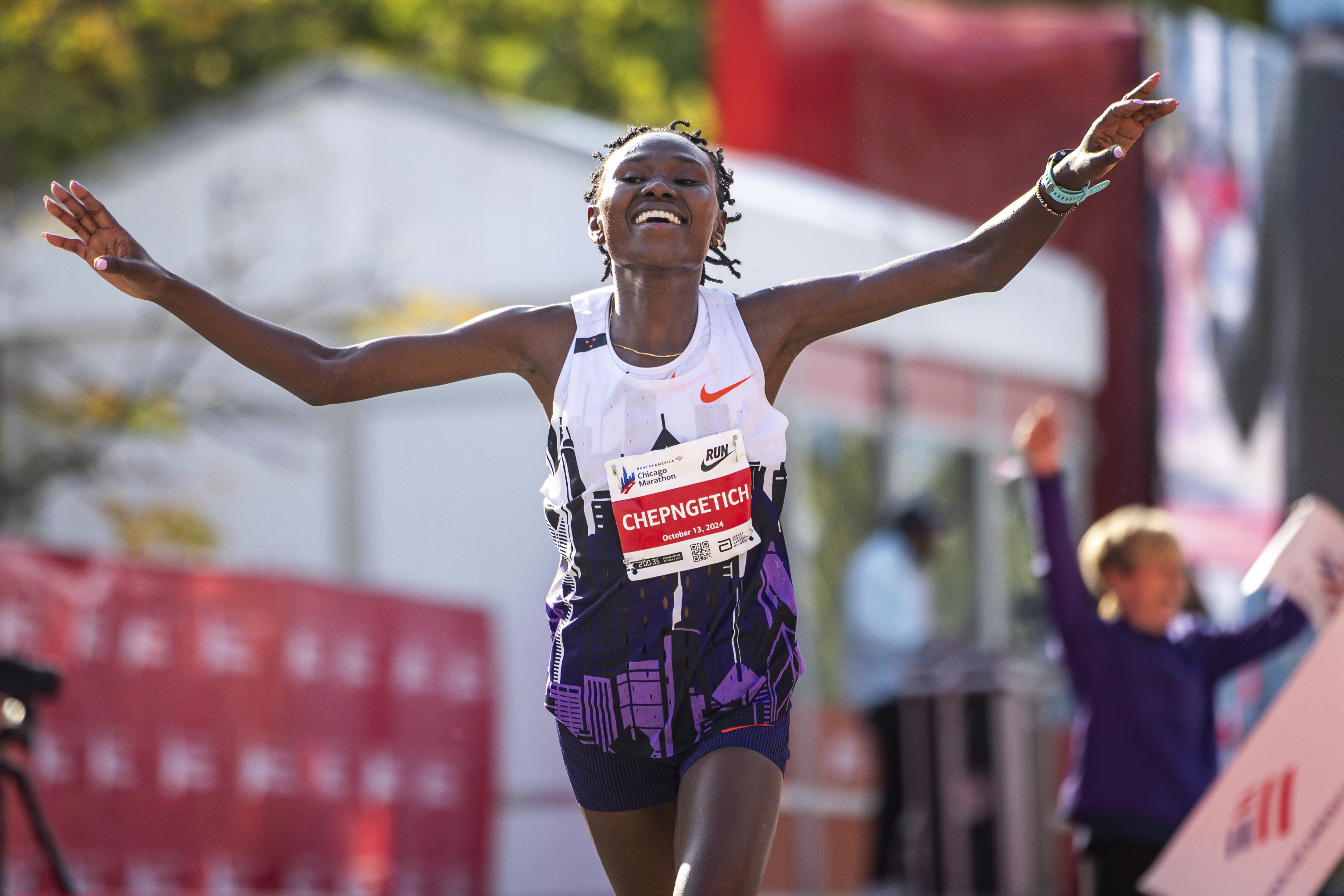FILE - Ruth Chepngetich, from Kenya, crosses the finish line of the Chicago Marathon to win the women's professional division and break the women's marathon world record in Grant Park on Oct. 13, 2024.