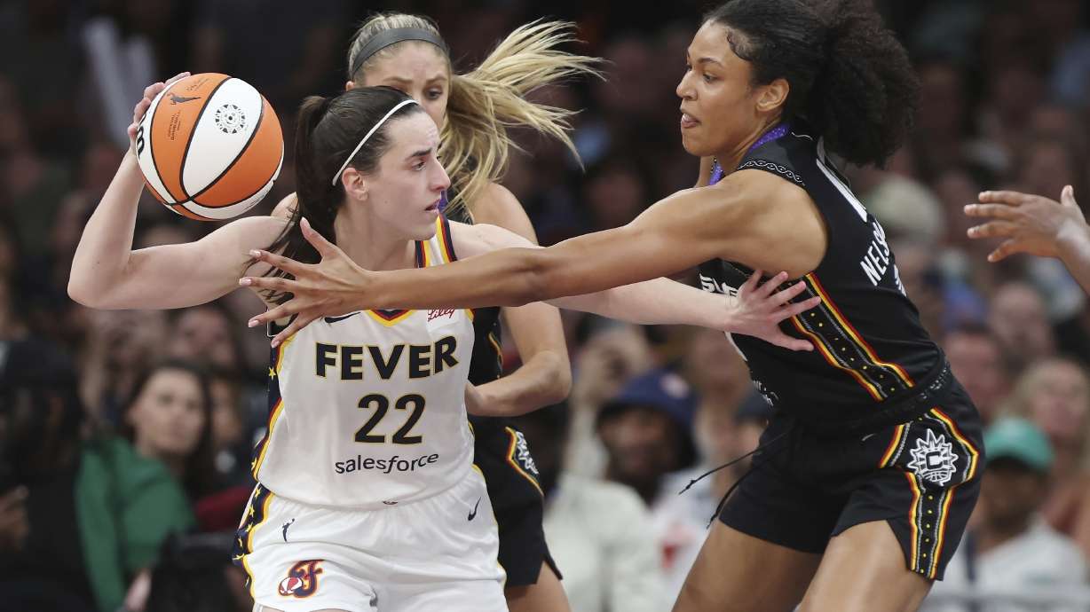 Connecticut Sun's Olivia Nelson-Ododa, right, defends against Indiana Fever's Caitlin Clark (22) during the second half of a WNBA basketball game, Tuesday, July 15, 2025, in Boston.