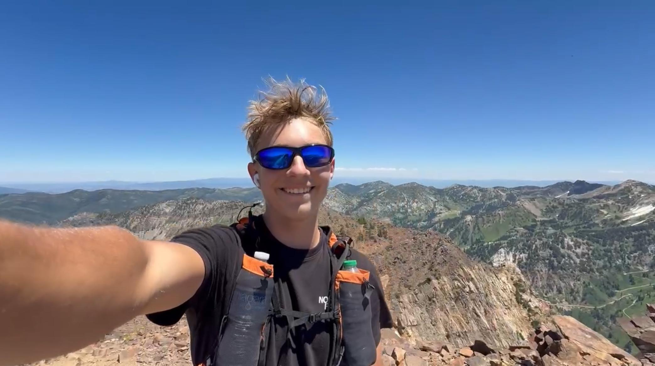 Maverick Dustin, 16, of Spanish Fork, takes a selfie at the top of Monte Cristo. He became the youngest person to complete the Wasatch Ultimate Ridge Linkup, a 36-mile course that follows the ridge surrounding Little Cottonwood Canyon, on July 12.