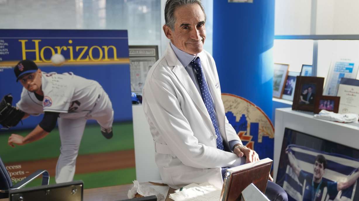 Dr. David Altchek poses in his office filled with sports memorabilia in New York, Thursday, Feb. 29, 2024.