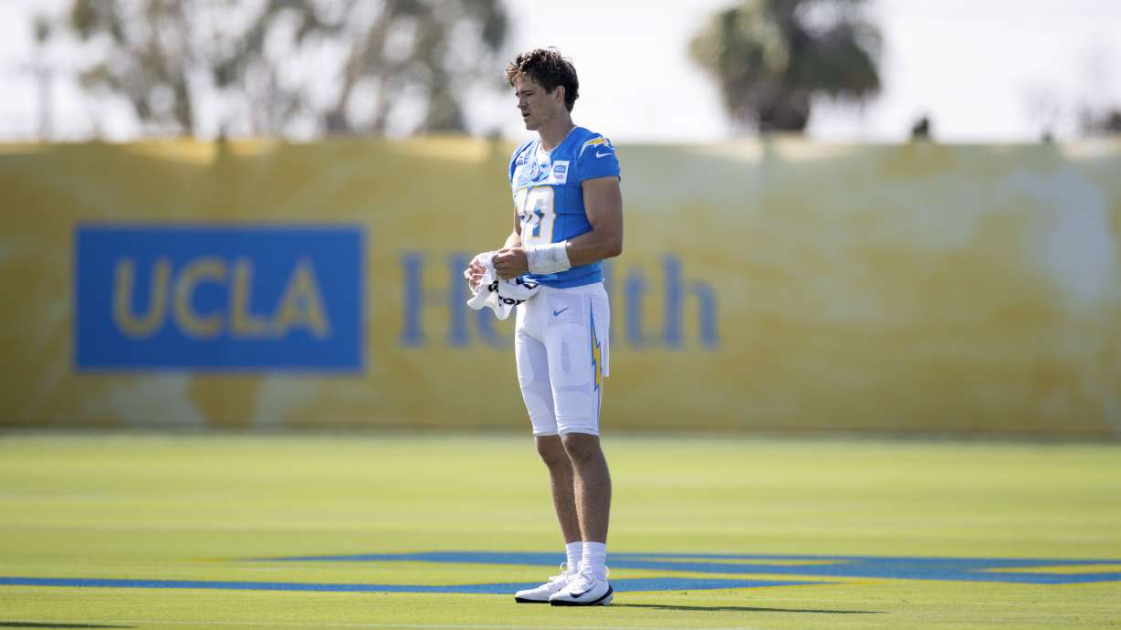 Los Angeles Chargers quarterback Justin Herbert stands on the field during training camp for the NFL football team Thursday, July 17, 2025, in El Segundo, Calif.