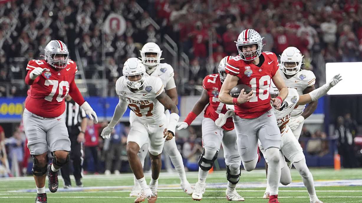 FILE - Ohio State quarterback Will Howard (18) runs against Texas during the second half of the Cotton Bowl College Football Playoff semifinal game, Jan. 10, 2025, in Arlington, Texas.
