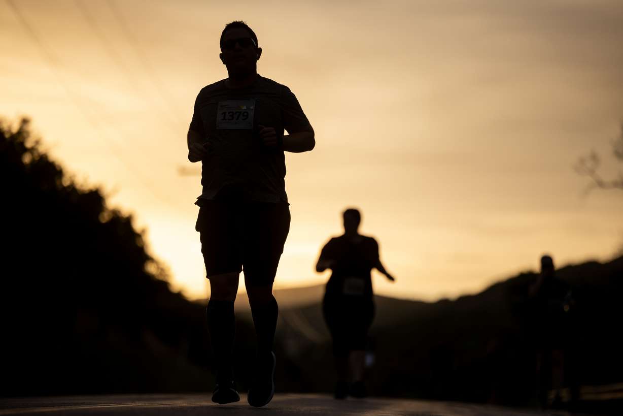 Runners make their way down Emigration Canyon during the Deseret News Half Marathon in Salt Lake County on Pioneer Day, July 24, 2023.
