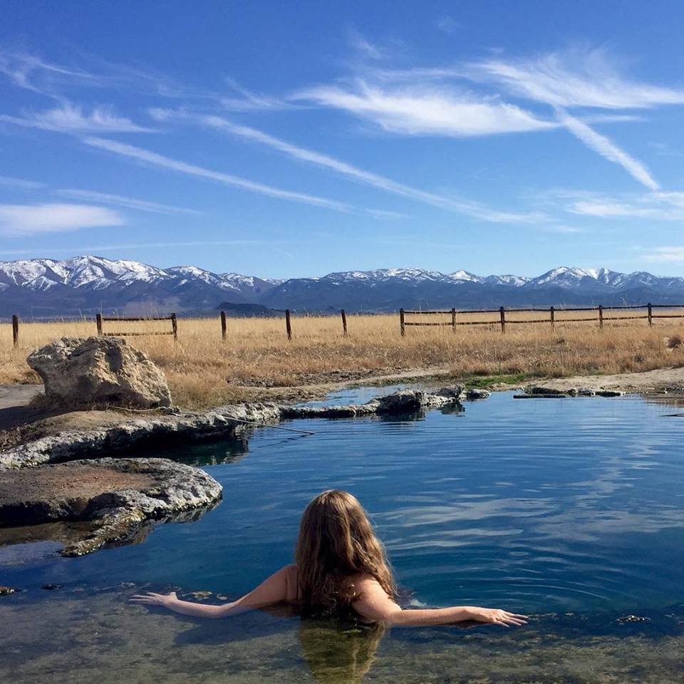A woman relaxes at Meadow Hot Springs in April 2016.