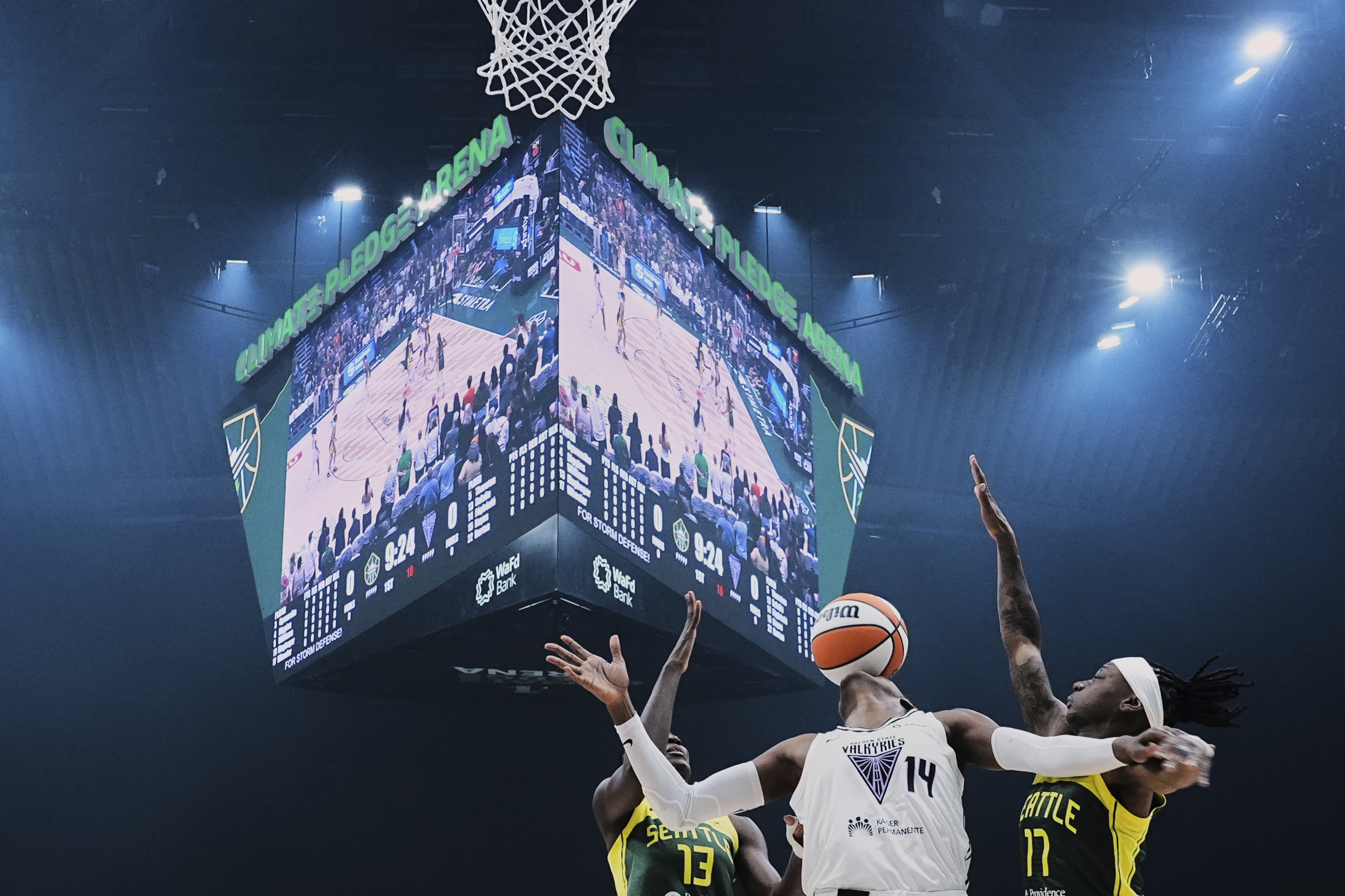 Golden State Valkyries center Temi Fagbenle (14) loses the ball against Seattle Storm forward Ezi Magbegor (13) and guard Erica Wheeler, right, during the first half of a WNBA basketball game Wednesday, July 16, 2025, in Seattle.