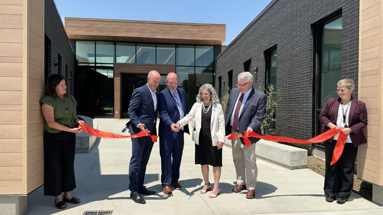 Utah Gov. Spencer Cox and officials from the Utah Department of Health and Human Services cut a ribbon for the opening of a comprehensive therapy building at the Utah State Developmental Center in American Fork on Thursday.