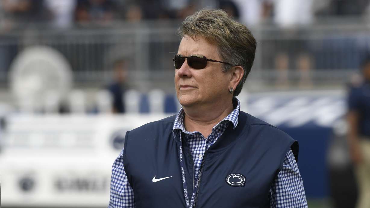 Penn State Vice President for Intercollegiate Athletics Sandy Barbour walks on the field following an NCAA college football game against Villanova in State College, Pa., on Saturday, Sept.25, 2021.