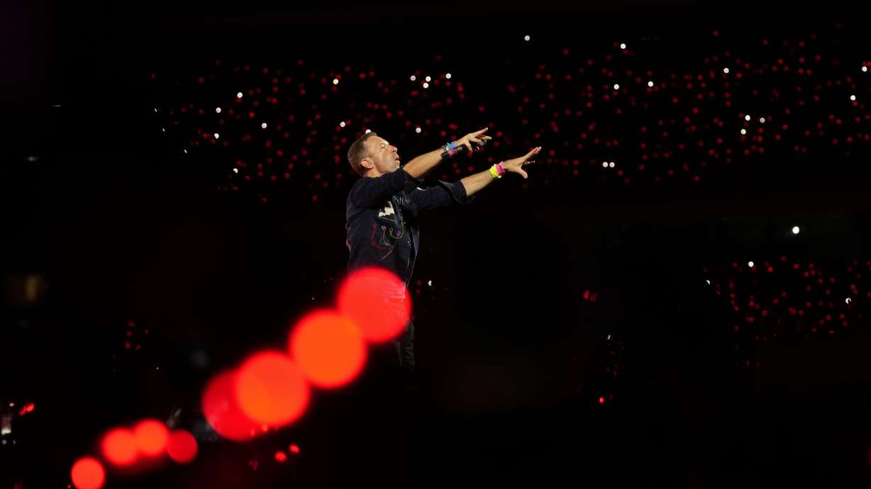 Chris Martin of Coldplay performs during the band's Music Of The Spheres World Tour in Navi Mumbai, India, Jan. 18. The band's concert Wednesday took an unexpected turn when a couple caught on the jumbotron went viral online.