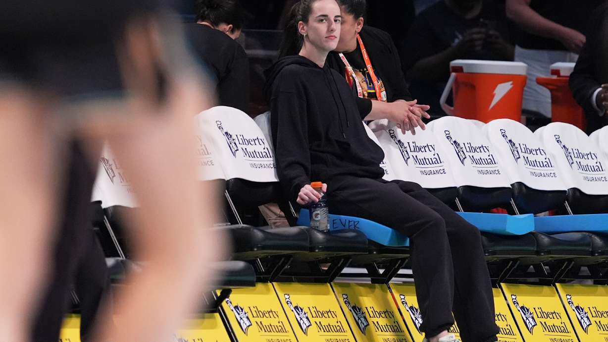 FILE - Indiana Fever's Caitlin Clark watches as players warm up before a WNBA basketball game between the New York Liberty and the Fever Wednesday, July 16, 2025, in New York.