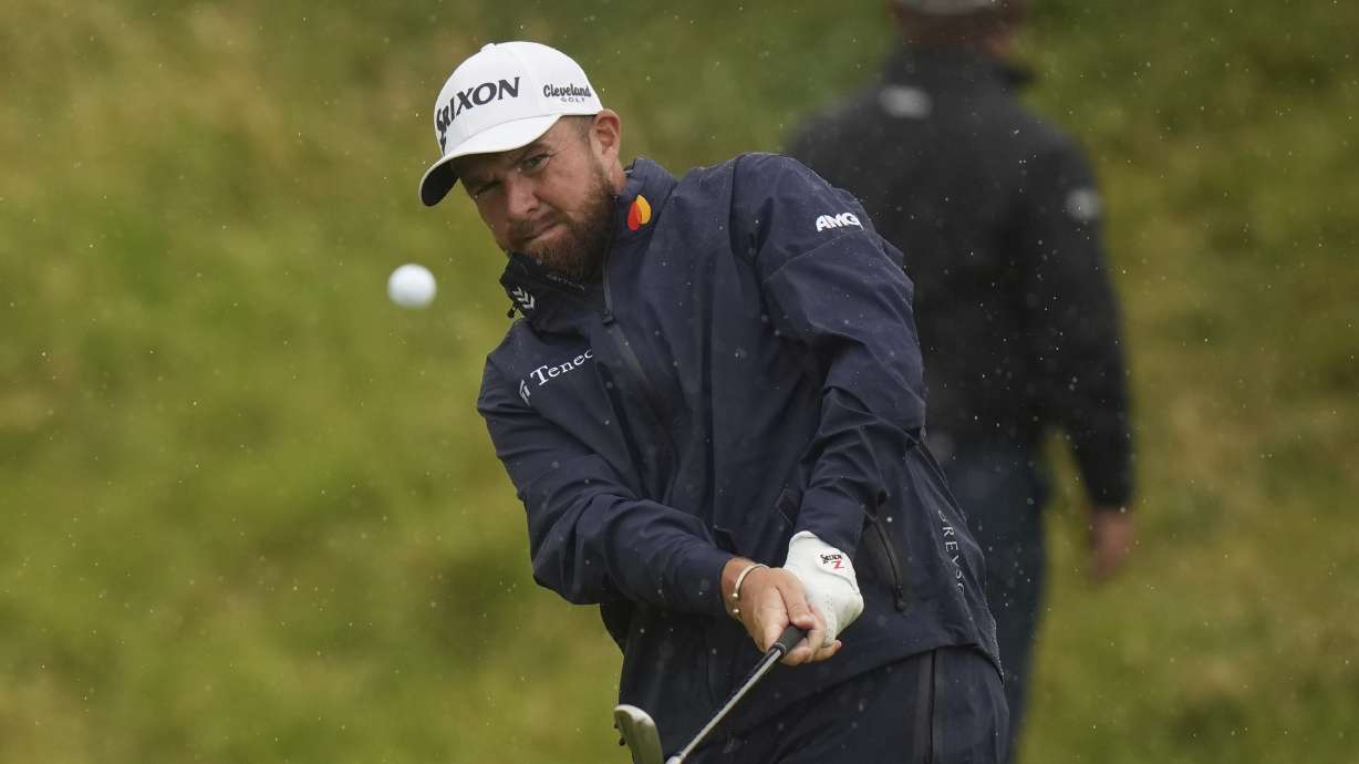 Shane Lowry of Ireland chips onto the 7th green during the first round of the British Open golf championship at the Royal Portrush Golf Club, Northern Ireland, Thursday, July 17, 2025.