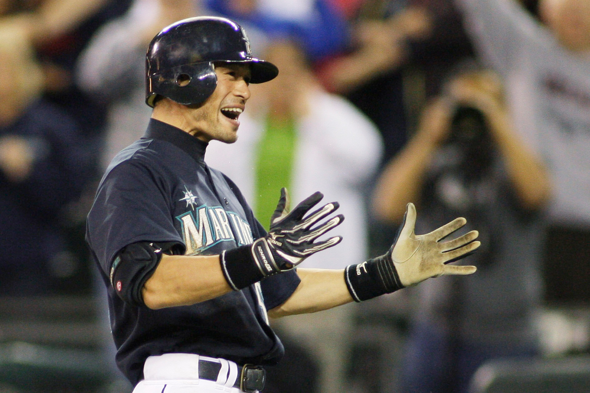 FILE - Seattle Mariners Ichiro Suzuki celebrates after he hit a two-run home run in the ninth inning to give the Mariners a 3-2 win over the New York Yankees in a baseball game, Friday, Sept. 18, 2009, in Seattle.