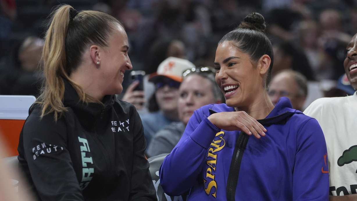 New York Liberty's Sabrina Ionescu, left, jokes with Los Angeles Sparks's Kelsey Plum during the skills challenge at the WNBA All-Star basketball weekend, Friday, July 18, 2025, in Indianapolis.