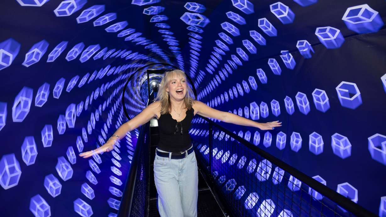 Sam Blake runs through the vortex tunnel at the Museum of Illusions in Salt Lake City on Thursday.