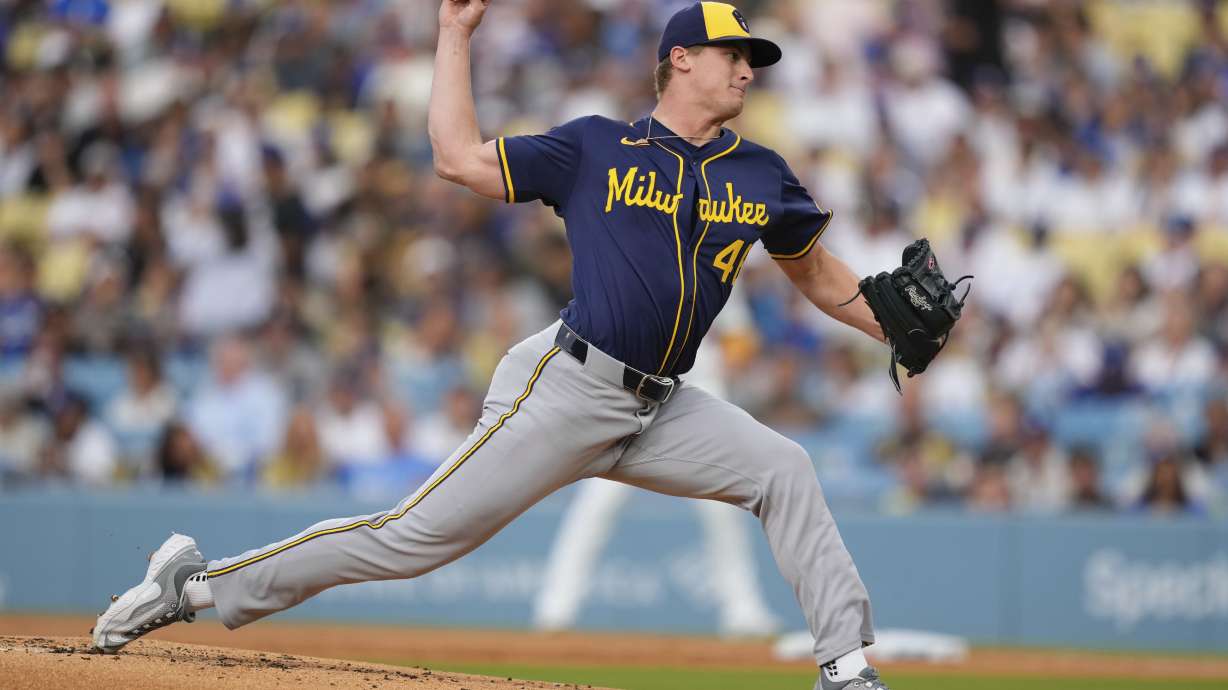 Milwaukee Brewers starting pitcher Quinn Priester throws to the plate during the first inning of a baseball game against the Los Angeles Dodgers, Friday, July 18, 2025, in Los Angeles.