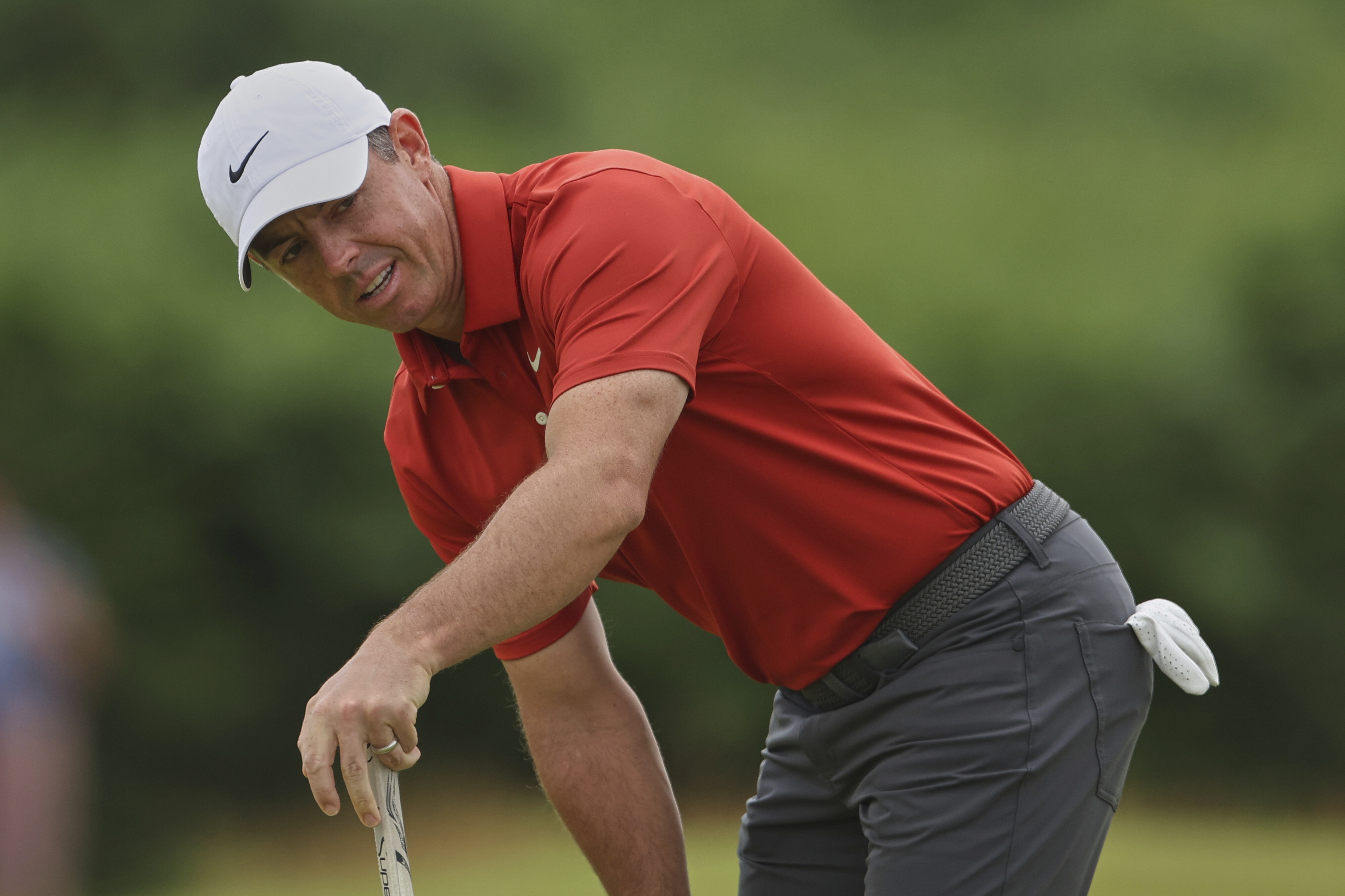 Buried ball baffles McIlroy in wild ride for hometown hero at British Open
