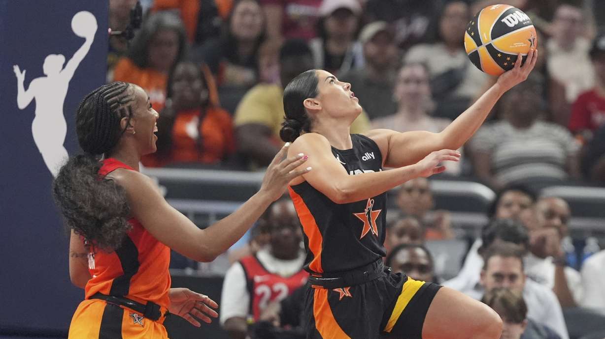 Los Angeles Sparks's Kelsey Plum, right, puts up a shot against Golden State Valkyries' Kayla Thornton during the first half of a WNBA All-Star basketball game, Saturday, July 19, 2025, in Indianapolis.