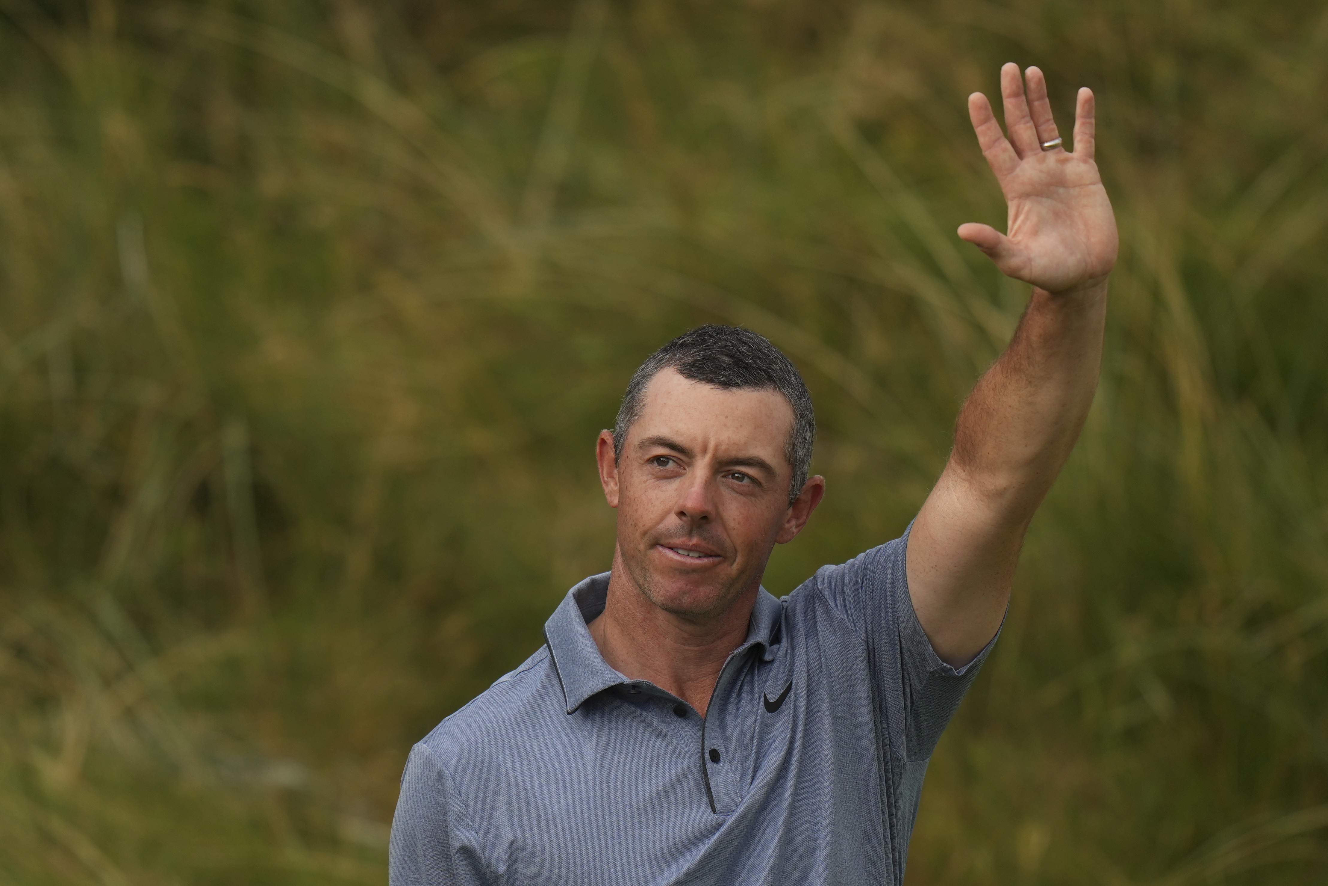 Rory McIlroy of Northern Ireland acknowledges the crowd as he walks onto the 18th green during the final round of the British Open golf championship at the Royal Portrush Golf Club, Northern Ireland, Sunday, July 20, 2025. 