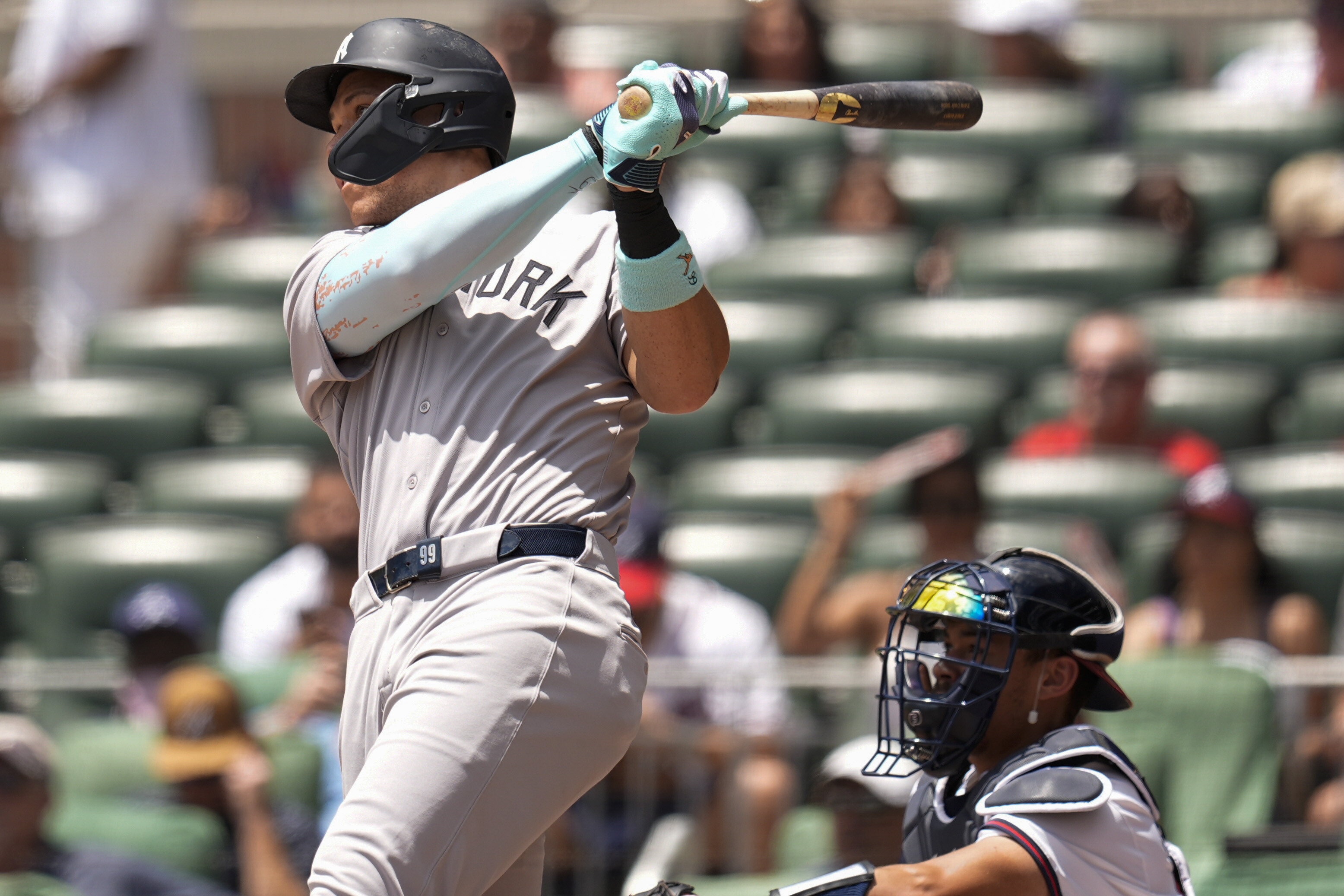 New York Yankees' Aaron Judge (99) hits a solo home run against the Atlanta Braves in the first inning of a baseball game, Sunday, July 20, 2025, in Atlanta. 