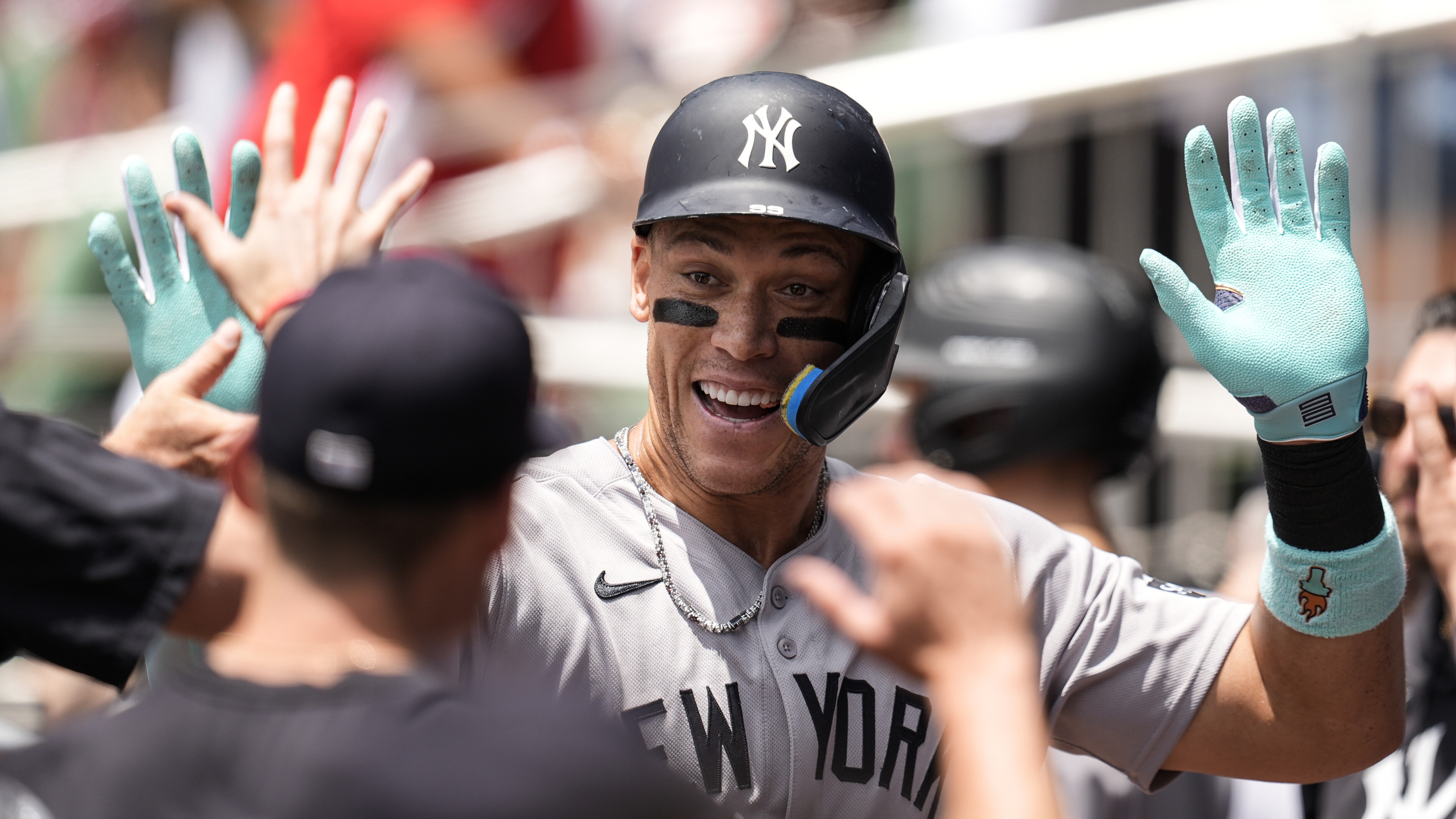 New York Yankees' Aaron Judge (99) celebrates his solo home run against the Atlanta Braves in the first inning of a baseball game, Sunday, July 20, 2025, in Atlanta. 