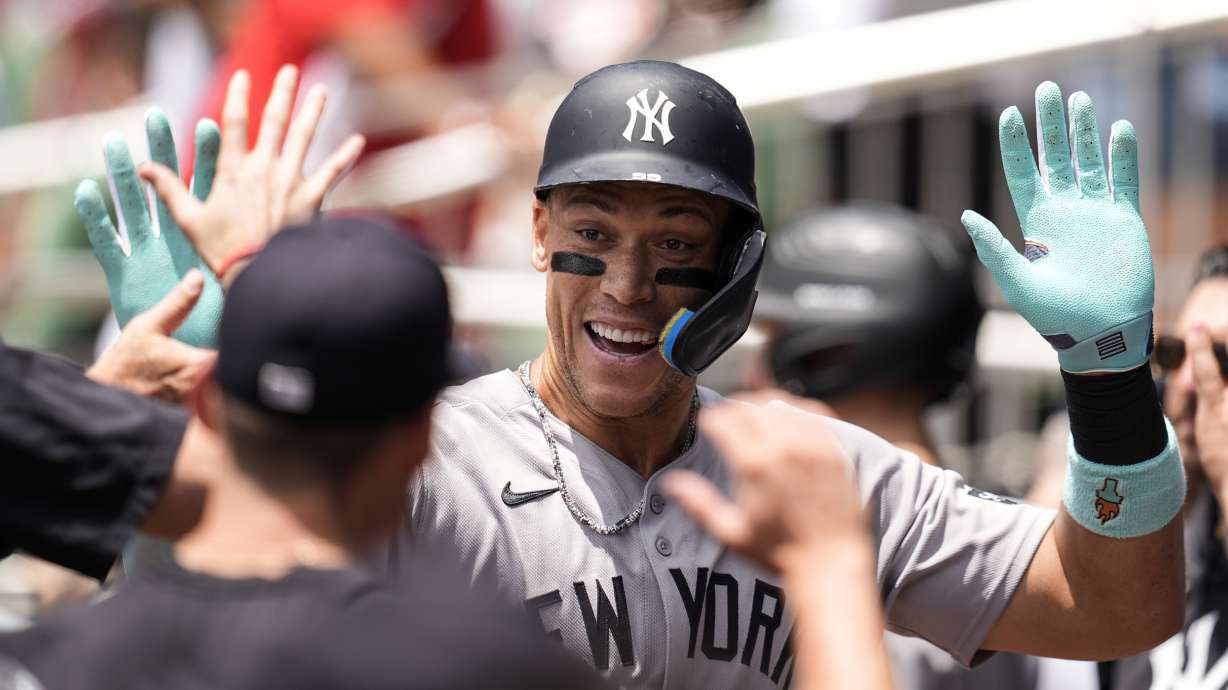 New York Yankees' Aaron Judge (99) celebrates his solo home run against the Atlanta Braves in the first inning of a baseball game, Sunday, July 20, 2025, in Atlanta.