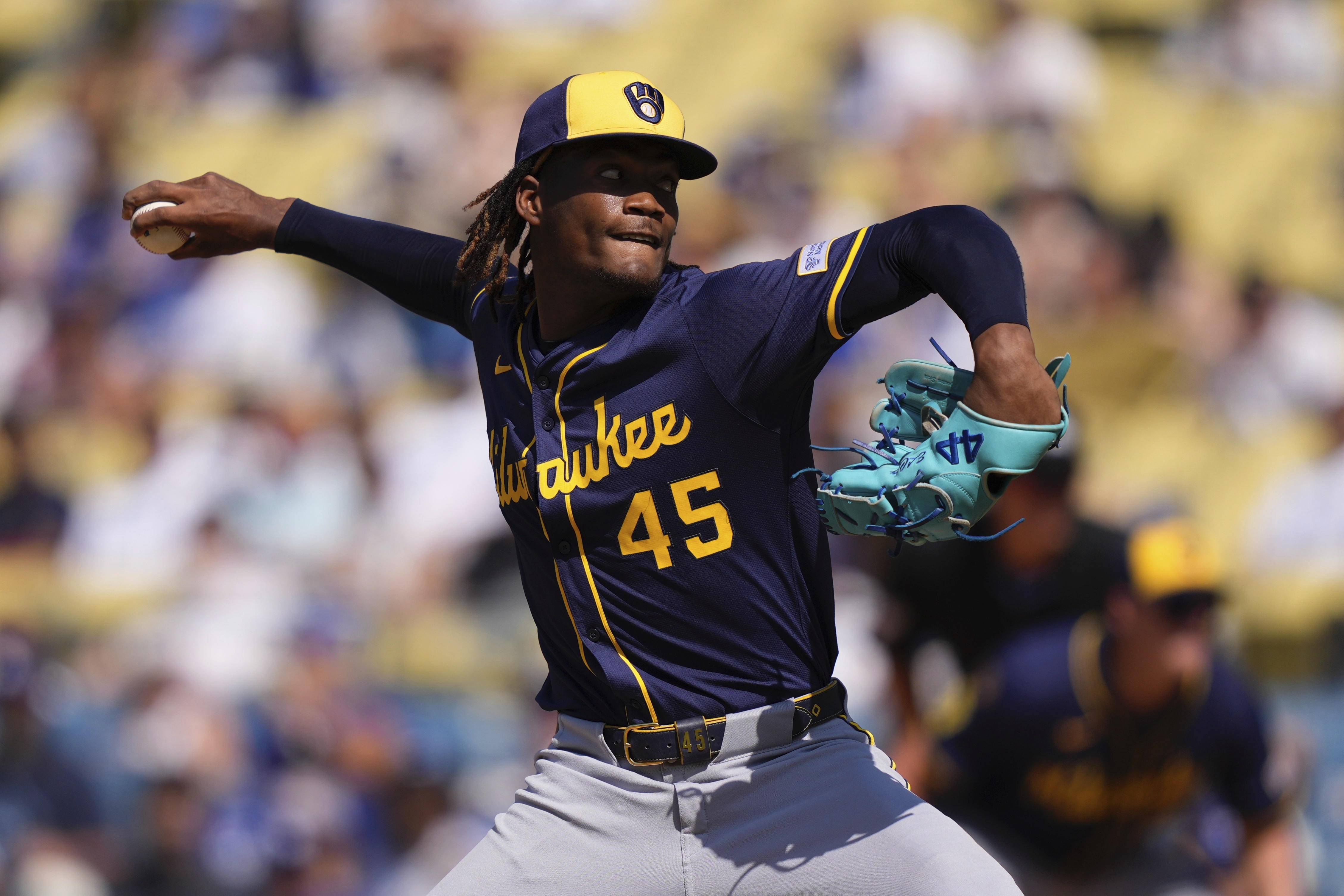 Milwaukee Brewers relief pitcher Abner Uribe throws to the plate during the ninth inning of a baseball game against the Los Angeles Dodgers, Sunday, July 20, 2025, in Los Angeles. 