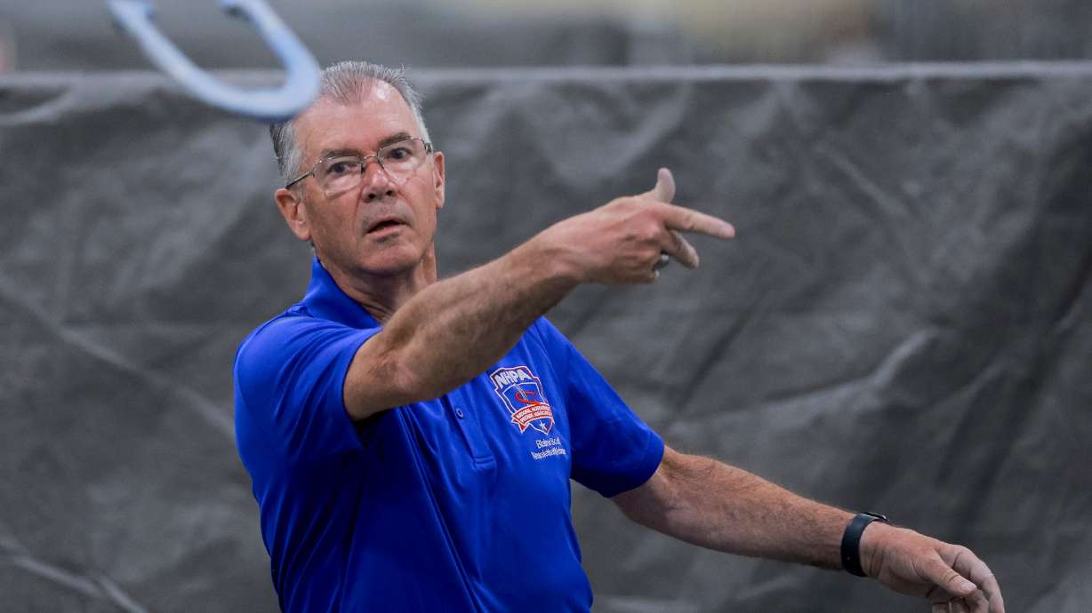 Blaine Scott throws a horseshoe as he prepares for the World Horseshoe Pitching Championships at the Mountain America Expo Center in Sandy on Saturday.