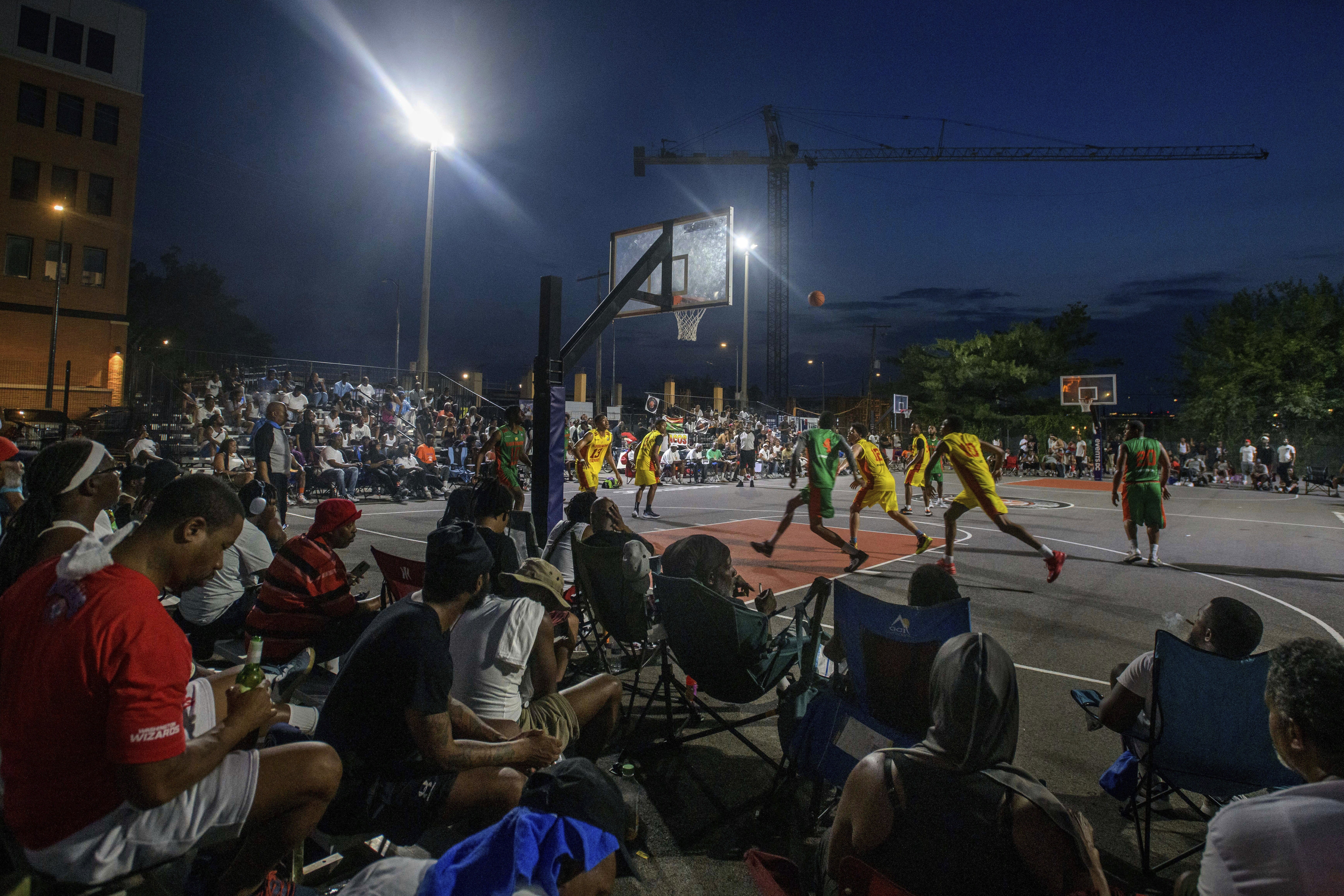 Players jostle for position for a rebound during a Goodman League basketball game Monday, June 30, 2025, in the Barry Farm neighborhood of Washington.