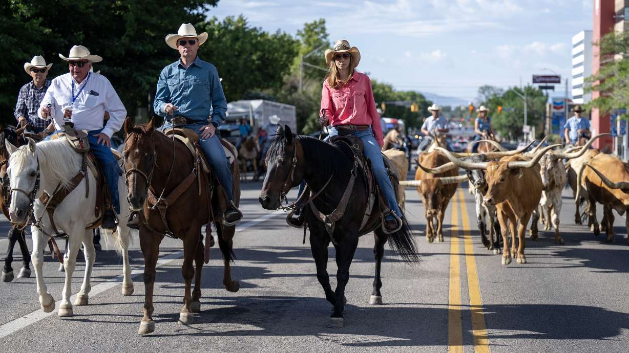 Gov. Spencer Cox, first lady Abby Cox and others begin the drive as they and several others kick off the Days of '47 with the annual longhorn cattle drive in Salt Lake City on Monday.