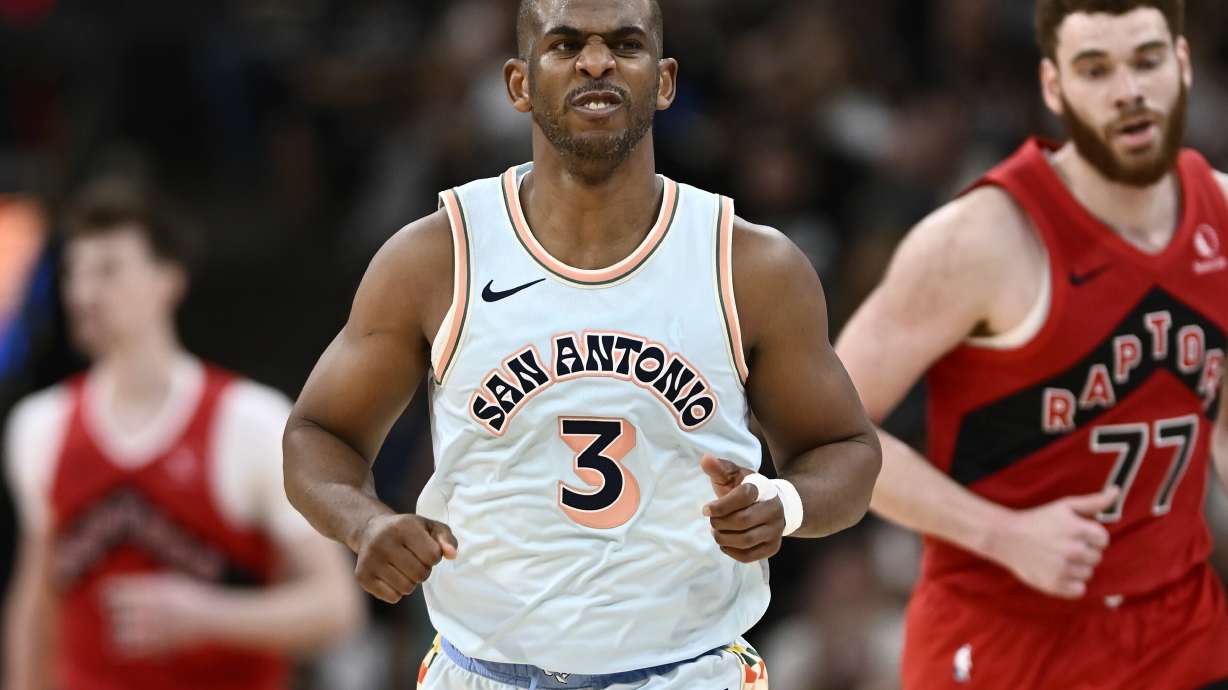 FILE - San Antonio Spurs guard Chris Paul (3) celebrates a basket during the second half of an NBA basketball game against the Toronto Raptors, April 13, 2025, in San Antonio.