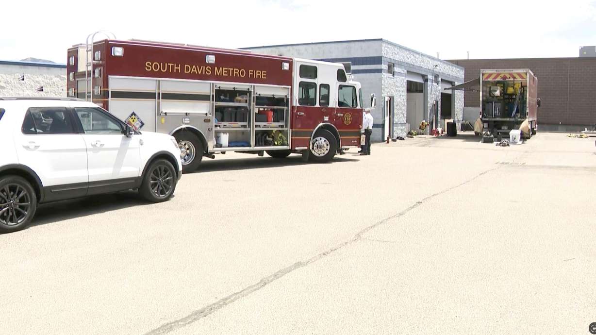 Fire crews from Davis County Metro Fire respond to a fire at 1187 S. Redwood Road in Woods Cross on Monday. A man suffered serious burns in the fire, the fire agency said.