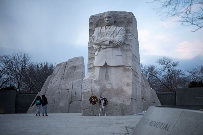 People walk by the Martin Luther King, Jr. Memorial, ahead of the presidential inauguration of President-elect Donald Trump, in Washington, January 16. The U.S. Justice Department on Monday released more than 240,000 pages of documents related to the assassination of King.