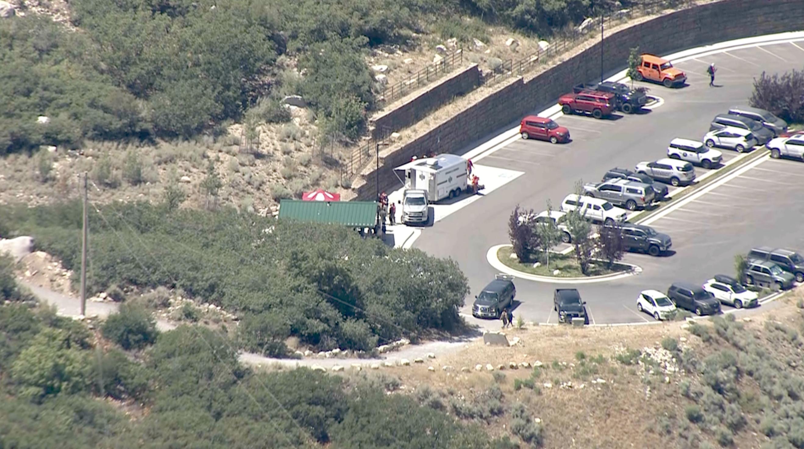 Emergency responders gather at Bells Canyon Trailhead after receiving a call reporting a man had fallen in a rockslide on the Pfeifferhorn trail on Saturday.